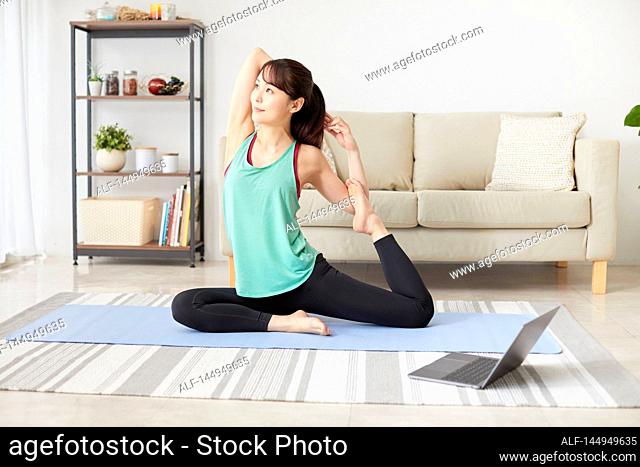 Healthy Japanese woman training at home