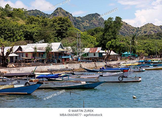 Coastline with fisher boats on Rinca island at the town Kampung Rinca