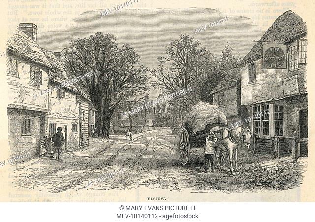 The village street at Elstow, Bedfordshire, in Victorian times - the surface is not made up, but then there's not much traffic besides the hay cart outside the...