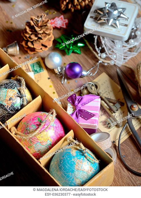 Gifts and vintage christmas ornaments on wooden table