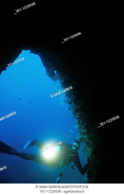 France marseille pierre a briancon cave scuba diver shines an underwater torch