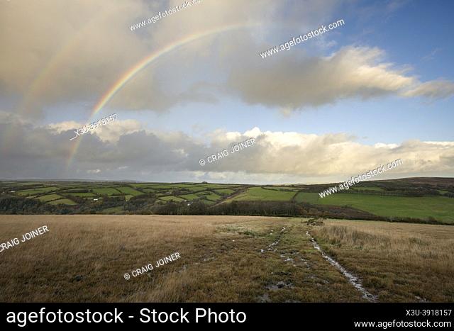 A double rainbow over the rolling hills of Exmoor National Park viewed from Withypool Hill, Somerset, England