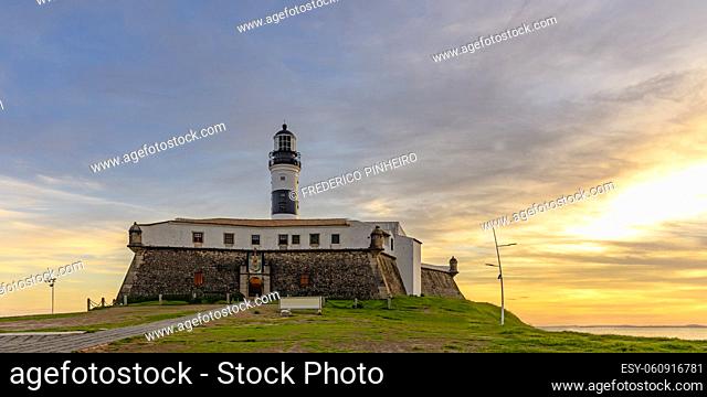 View of the famous Barra Lighthouse in Salvador, Bahia during sunset in summer in northeast Brazil