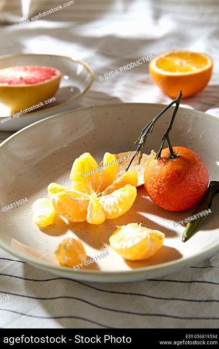 still life with mandarins and grapefruit on plate