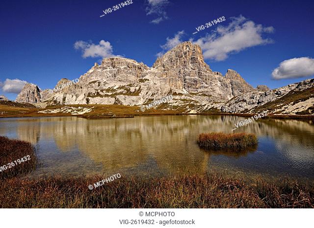 The Scarperi mountain range reflected in the Bodensee lake in the Sesto Dolomites region of northern Italy. - Sesto, Dolomites, N. Italy, 01/01/2011