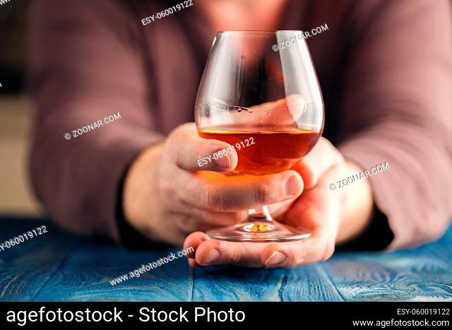 Man alone relax with alcohol after hard work