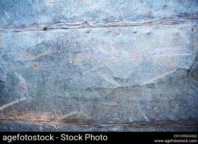 Metal background with traces of old age, traces of iron nails