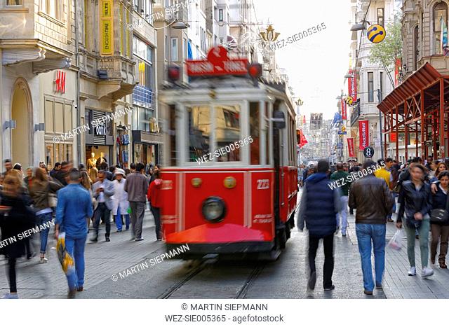 Turkey, Istanbul, Beyoglu, People and historical tram on Istiklal Caddesi road