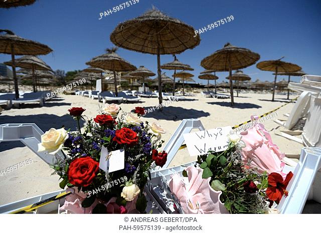 Flowers and a note which reads ""Why? Warum?"" on a sun lounger at the Imperial Marhaba Hotel in Sousse, Tunisia, 27 June 2015