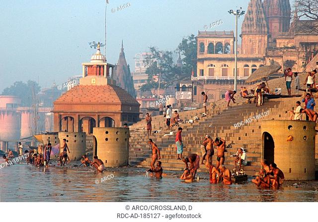 Hindu pilgrims washing in river Ganges, near Varanasi, India