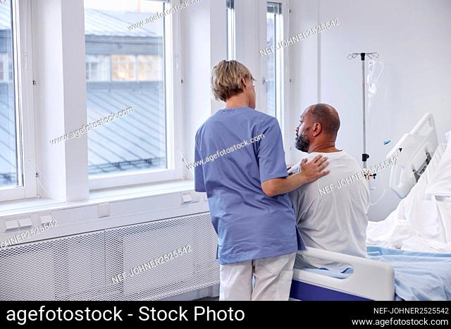 Nurse taking care of patient in hospital