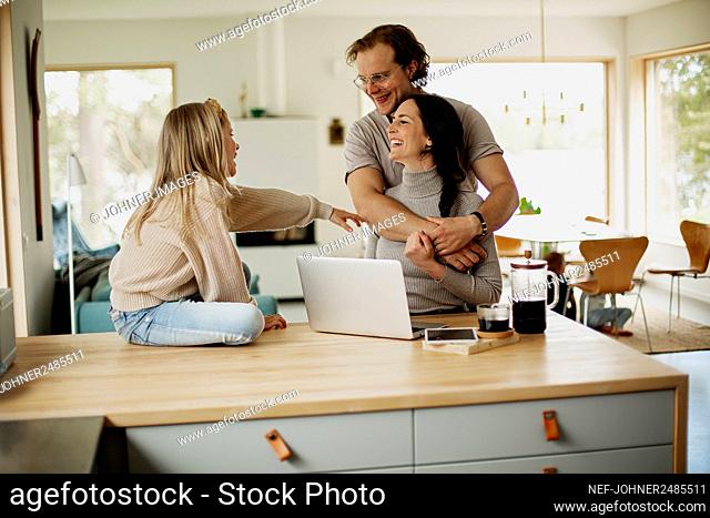 Parents with daughter at home