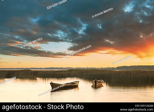 Wooden Rowing Fishing Boats In Beautiful Summer Sunset On Lake. Nature Of Belarus