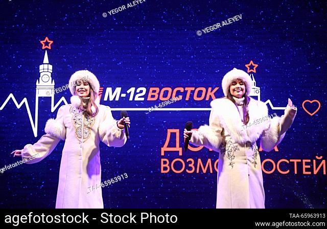 RUSSIA, KAZAN - DECEMBER 21, 2023: Women perform ahead of a motor race to start from the Kazan Kremlin and mark the opening of the M12 Vostok Highway that links...
