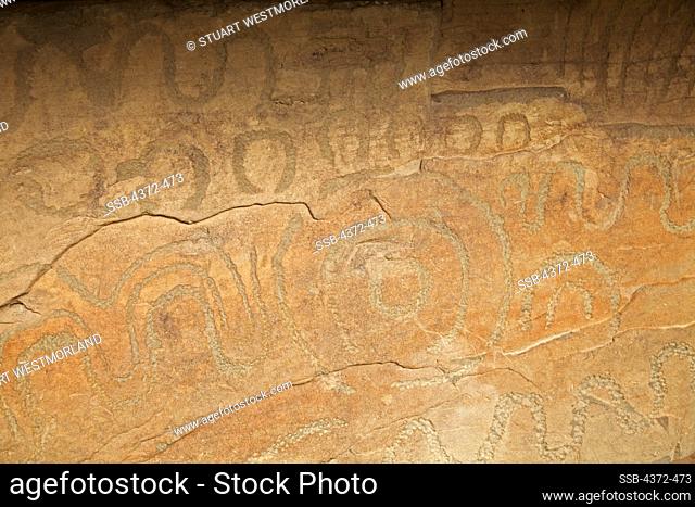 Stone carvings at Knowth, the passage tomb complex at the western end of Bru Na Boinne, with 127 massive kerbstones, north of Dublin, Ireland