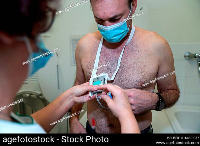 Placement of a holter on a fifty-year-old suffering from cardiac arrhythmia