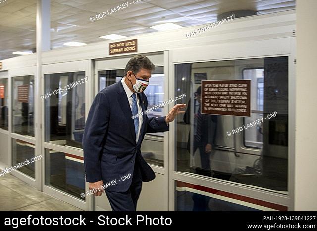 United States Senator Joe Manchin III (Democrat of West Virginia) acknowledges a fellow Senator on the Dirksen Senate Office Building Senate subway platform...