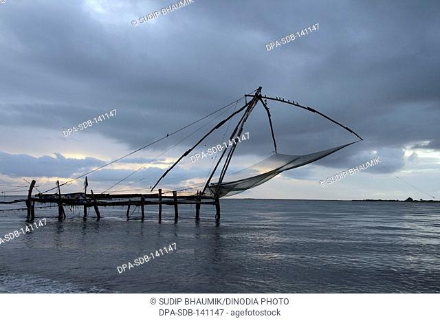 Chinese fishing net ; Kochi harbour ; Kochi ; Kerala ; India