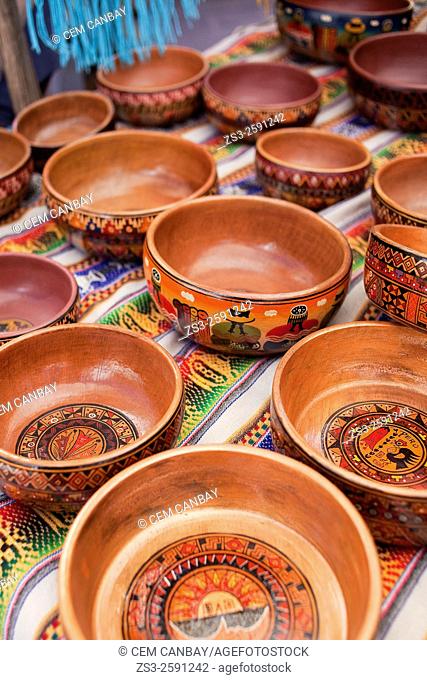 Close-up shot of wooden bowls at the open-air market in Pisac, Sacred Valley, Cusco Region, Peru, South America