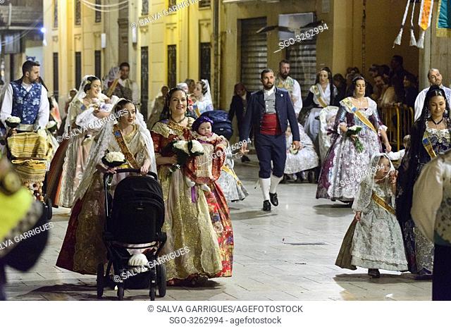 Mothers carry babies in front of the Virgin happy. The fallera and the falleros deliver the flowers very excited. Each fallera carries a bouquet of keys that...