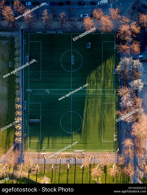 Copenhagen, Denmark - April 17, 2020: Top down aerial drone view of a two soccer fields in Norrebro district