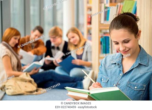 School student studying in library