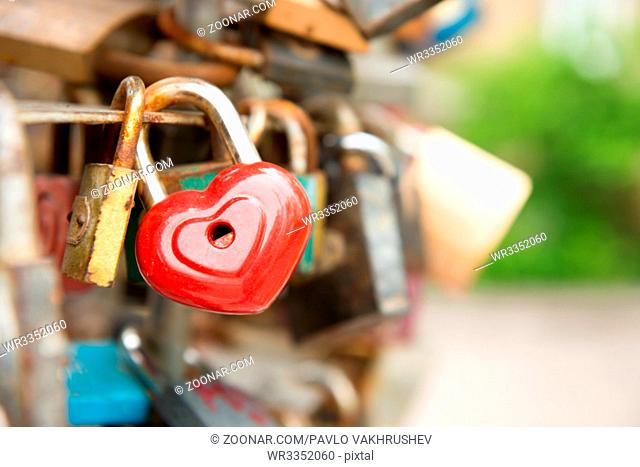 Love red romance lock with heart shape on the bridge