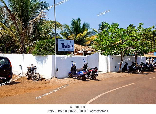 Vehicles parked outside the restaurant, Thalassa, Little Vagator Beach, Nine Bar, Vagator, Bardez, North Goa, Goa, India