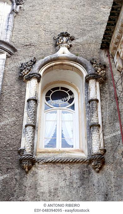 Window in the Neo-Manueline architectural style of the Palace Hotel of Bussaco, built in late 19th century, in Bussaco, Portugal