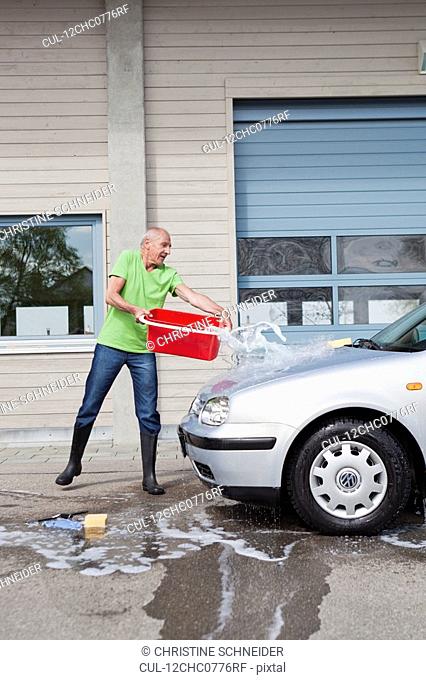 old man washing car
