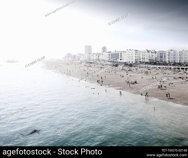 England, Brighton, People resting at urban beach