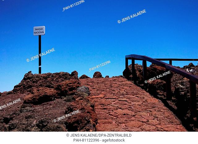 A picture dated 23 May 2016 shows the blue sky and a sign saying 'national park' on the peak of Roque de los Muchachos at an altitude of 2
