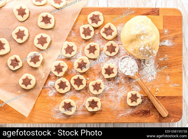 Baking christmas cookies with chocolate star. Homemade bakery, xmas sweet, winter holidays concept