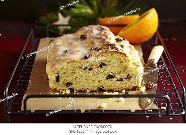 Orange yeast dough stollen with icing for Christmas