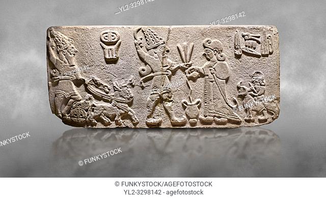 Aslantepe Hittite Orthostat. Limestone, Aslantepe, Malatya, 1200-700 B. C. . . Scene of offering drink and sacrifice. The god, with a symbol of divinity above