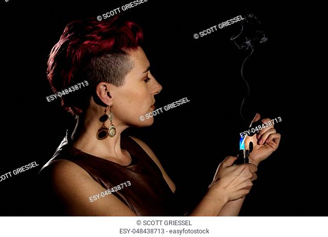 Modern woman with fuchsia hair and a cigar