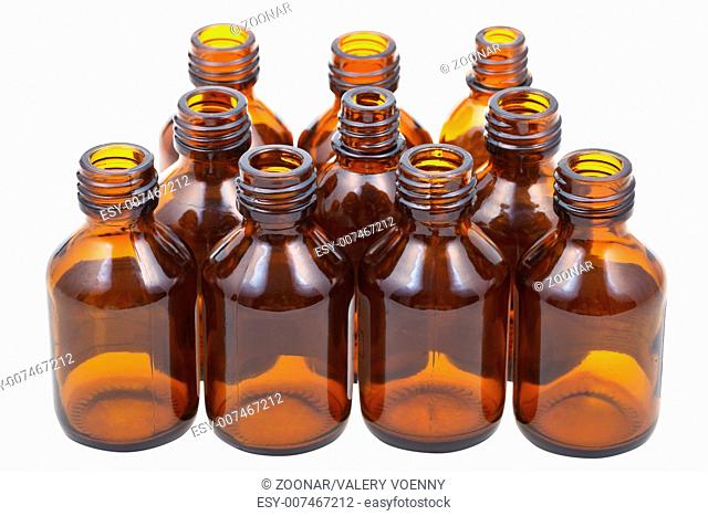 many little open brown glass pharmacy bottles