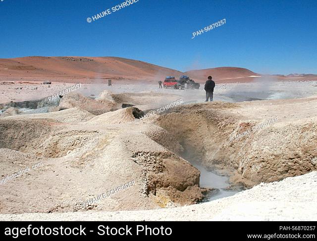 Tourists on a jeep tour during a rest in the geyser field «Sol de Manana» on October 15, 2009. The geyser field, which lies in the Andes Altiplano between the...