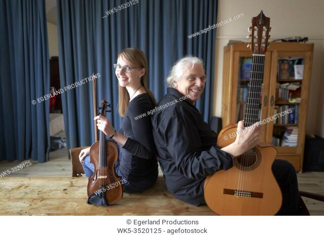 musical duo, ready to play duet with violin and guitar