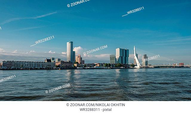 Rotterdam city cityscape skyline with Erasmus bridge and Nieuwe Maas (Rhine) river in front. South Holland, Netherlands