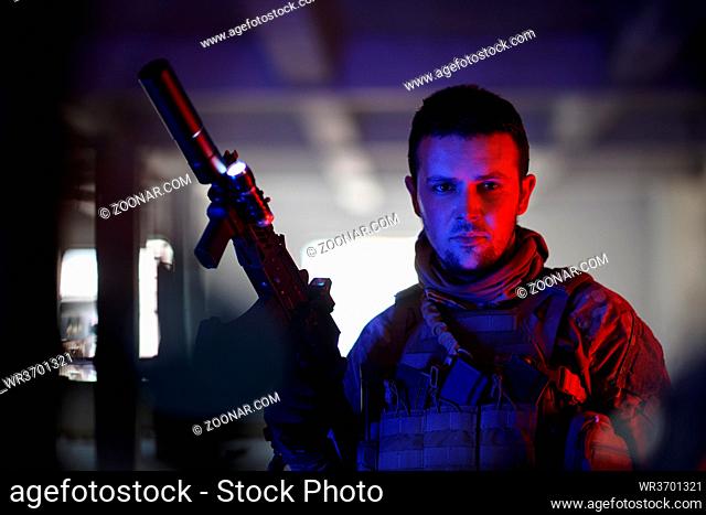 modern warfare soldier in urban environment portrait color lighti ng background