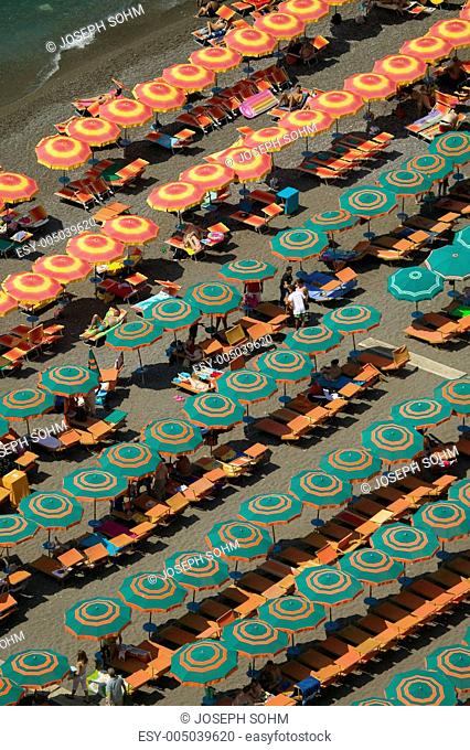 Elevated pattern view of famous beach umbrellas of Amalfi, a town in the province of Salerno, in the region of Campania, Italy, on the Gulf of Salerno
