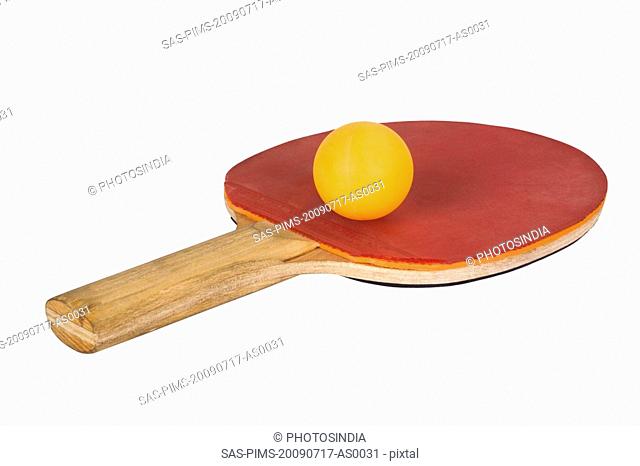 Close-up of a table tennis racket with a ball