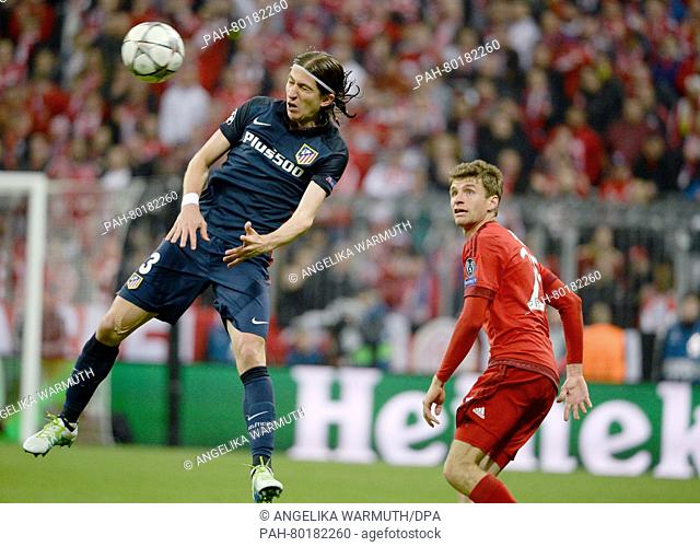Munich's Thomas Mueller (R) in action against Madrid's Filipe Luis during the UEFA Champions League semi final second leg soccer match between Bayern Munich and...