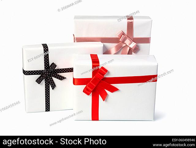 white present paper boxes with ribbon bow, isolated on white