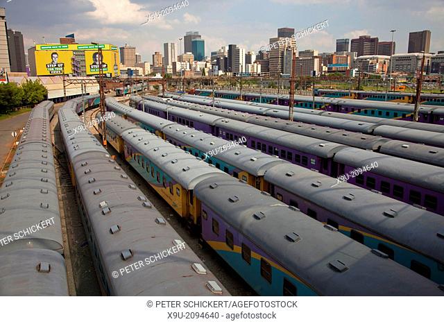 trains and tracks of the central Park Station and the skyline of Johannesburg, Gauteng, South Africa, Africa