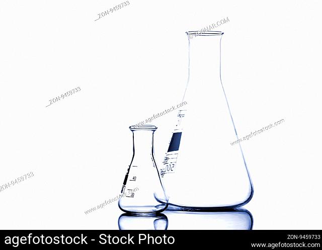 Test-tubes with reflections on a white and blue background. Laboratory glassware