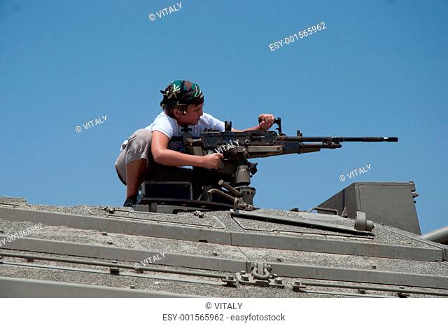 Machine gun mounted on top of the turret