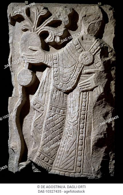 Figure of a bishop, fragment from a group depicting a baptismal procession, marble bas-relief. Italy, 10th century.  Capua