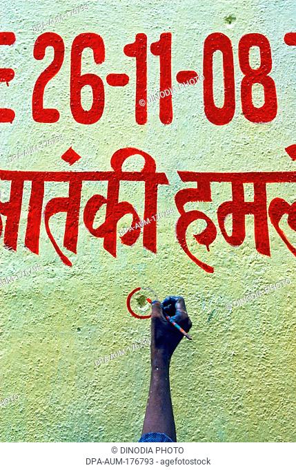 Painter encircle bullet marks on the wall , Bombay , Mumbai , Maharashtra , India